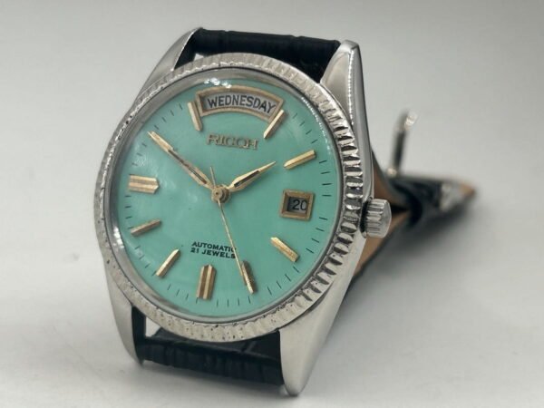 Vintage Ricoh Men?s Automatic Watch ? 21 Jewels, Day & Date Display, Turquoise Dial, Leather Strap